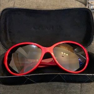 Red Chanel sunglasses.